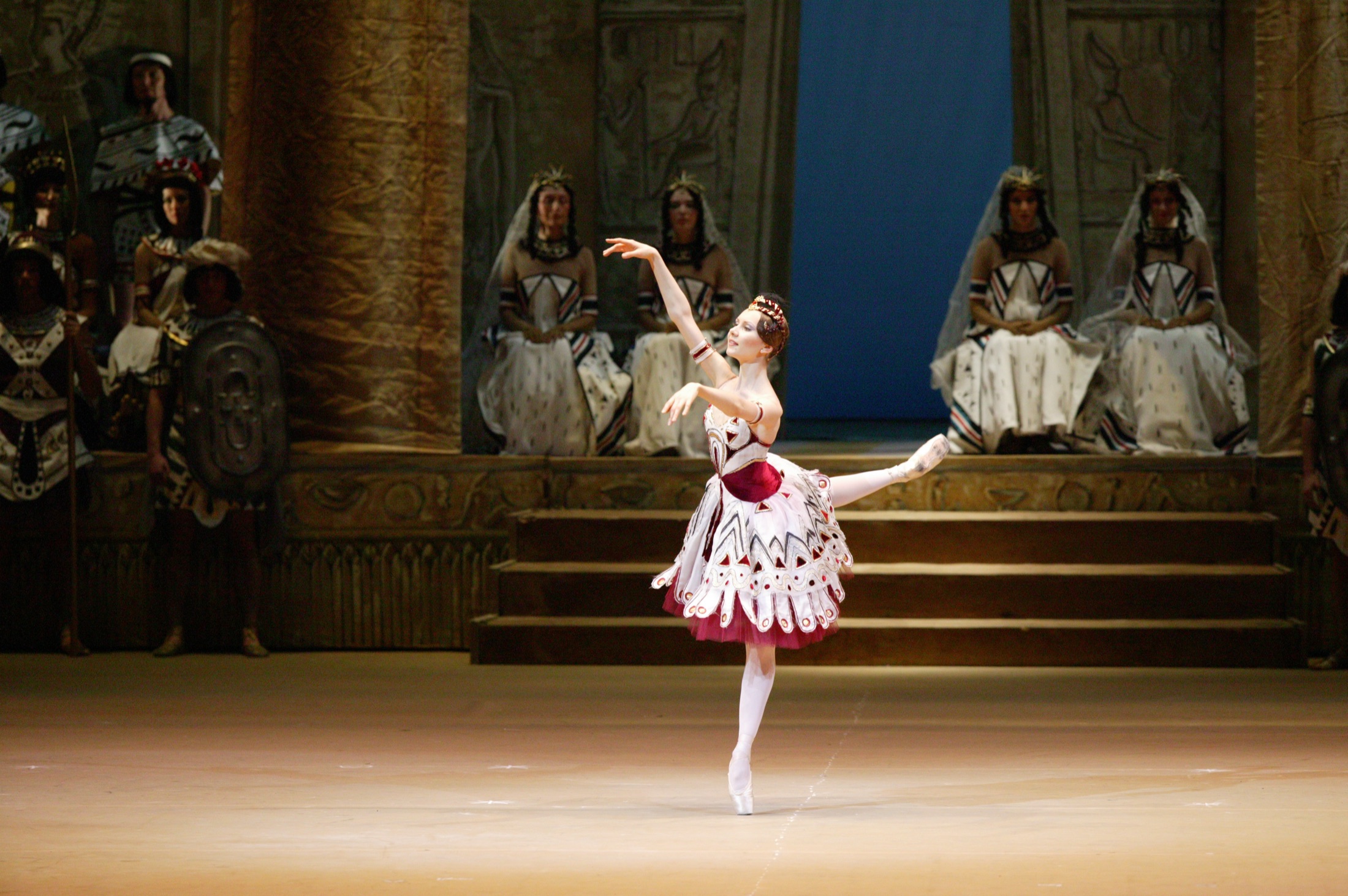 Anastasia Kurkova balancing on pointe in a stage performance